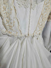 Vintage white wedding dress with gold lace and train