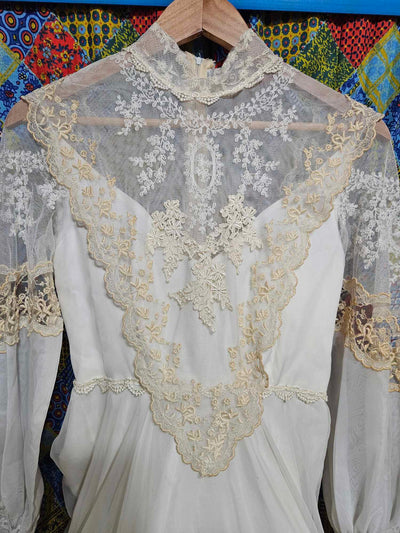 Vintage white wedding dress with gold lace and train