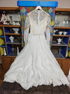 Vintage white wedding dress with gold lace and train