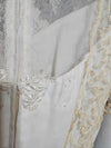 Vintage white wedding dress with gold lace and train