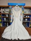 Vintage white wedding dress with gold lace and train